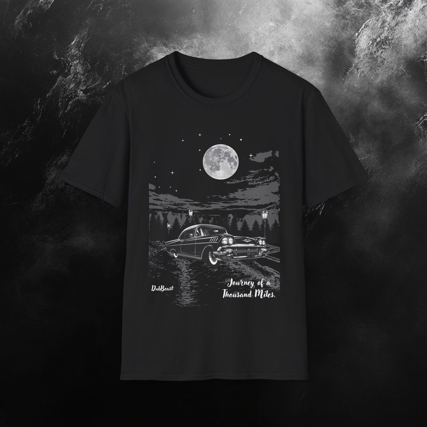 Black t-shirt with a classic car graphic under a full moon, surrounded by trees and the phrase 'Journey of a Thousand Miles