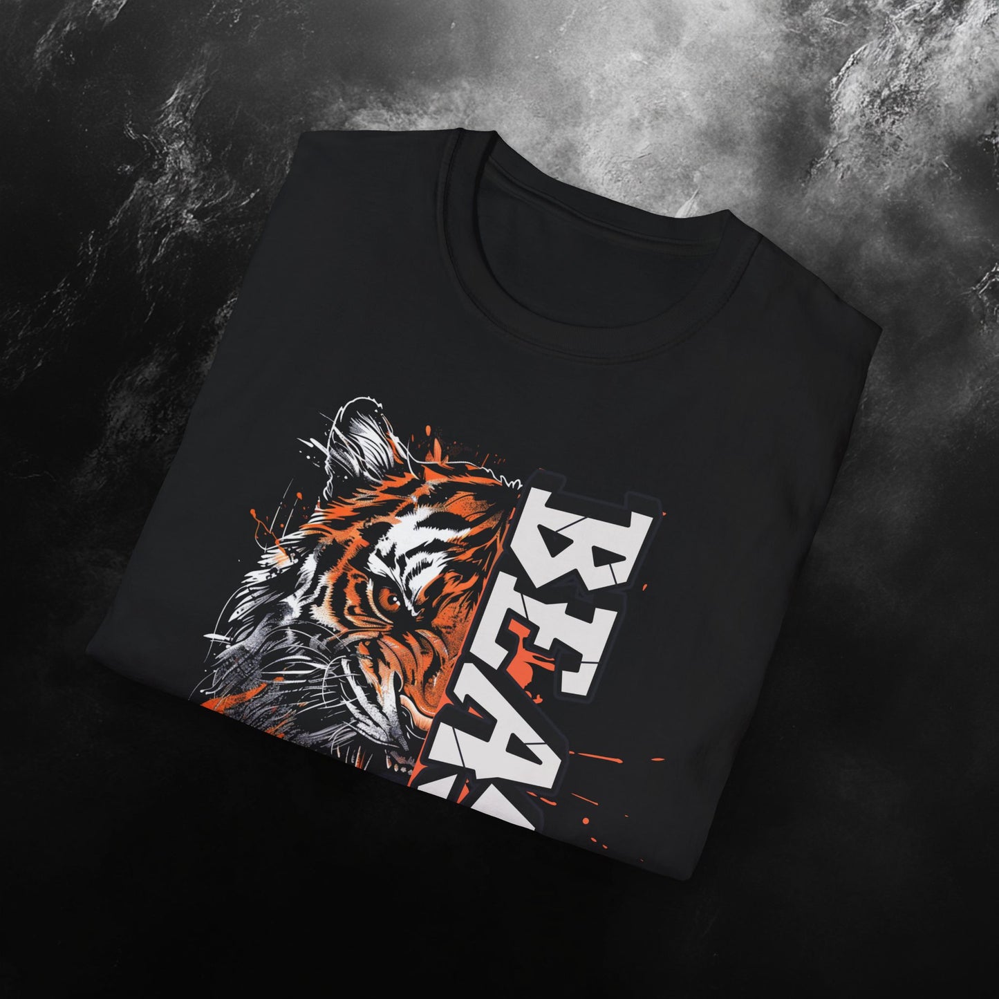 close up of a folded black t-shirt featuring a fierce tiger graphic with bold orange accents and the word 'BEAST' in large vertical block text, complemented by the DubBeast logo at the bottom